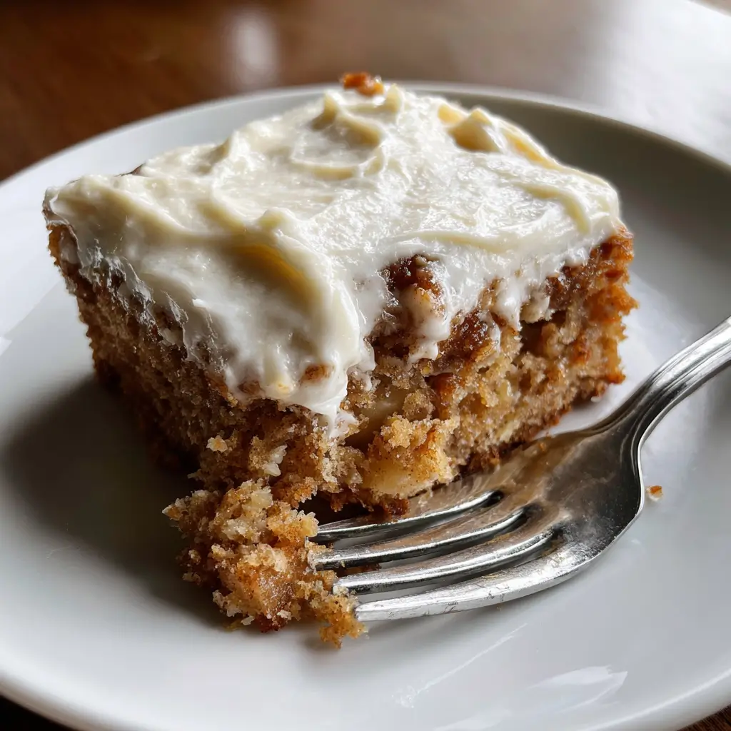 3-Ingredient Apple Cake: 1 Easy, Amazing Dessert Idea 5 Slice of 3-Ingredient Apple Cake with cinnamon frosting on a white plate
